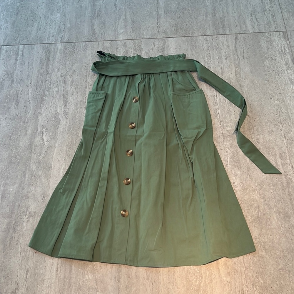 No brand listed green skirt with brown buttons and tie